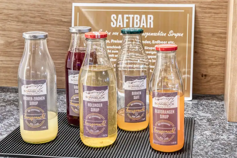 Juice bar with homemade syrups: ginger-lemon, elderflower, blood orange and pear juice