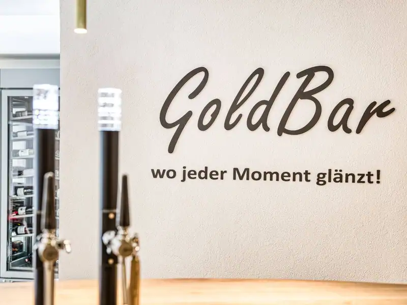 GoldBar lettering – where every moment shines, beer taps in front