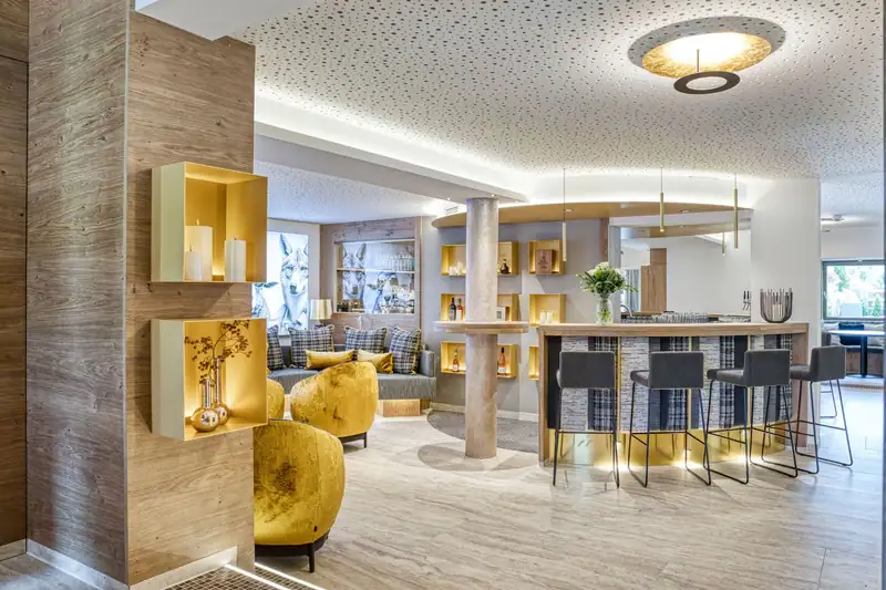 Lounge with yellow armchairs and bar