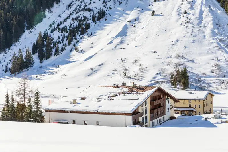 Hotel beneath a deep-snow slope