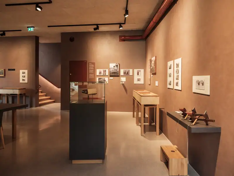 Exhibition in the ibex centre with historical photos, display cases and stereo viewers