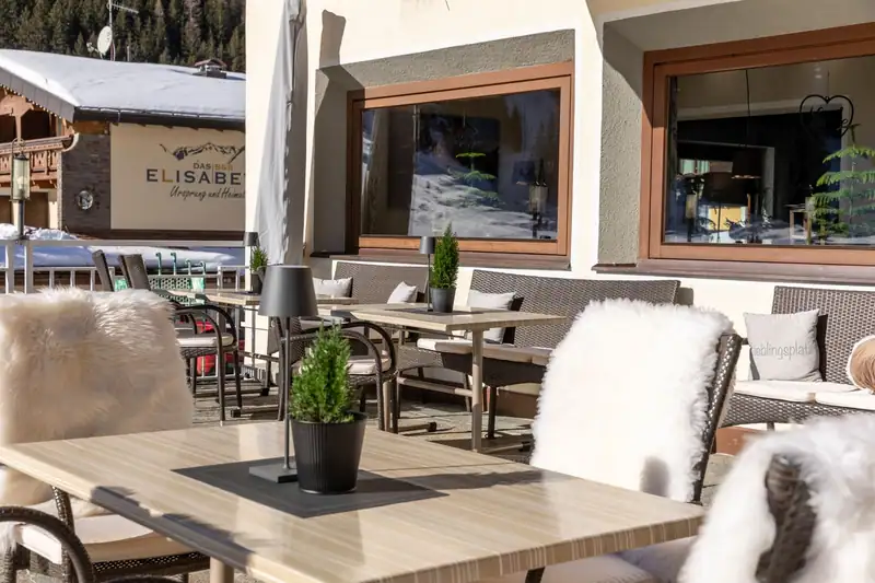 Sun terrace with sheepskins on the chairs in winter
