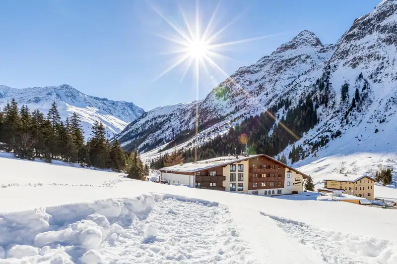 Hotel Sonnblick and B&B Elisabeth in the snowy valley in brilliant winter sunshine