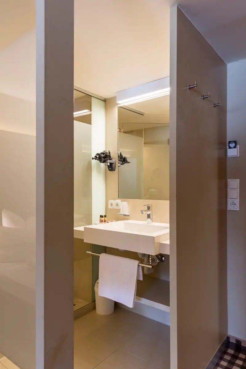 Washbasin with mirror and hairdryer in the bathroom