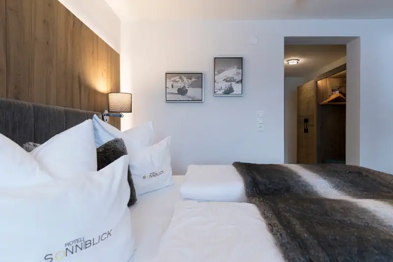 View from the bed to the entrance with open wardrobe
